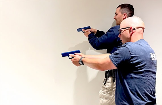 Active law enforcement officers practicing safety procedures at Douglas County Sheriff's Office.